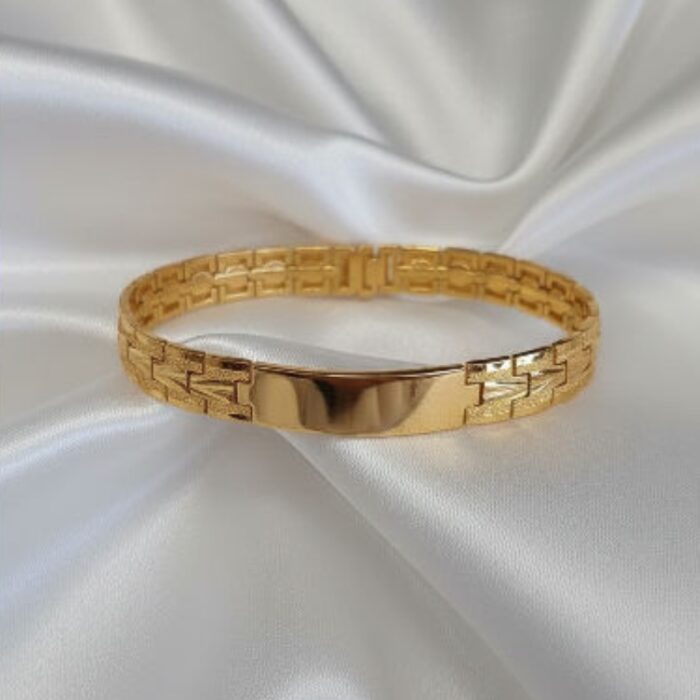 ⁦سوار ستانليس فاخر بتصميم أنيق لمعة راقية تلفت الأنظار وتضفي لمسة فخمة على أي إطلالة لون ذهبي⁩ - الصورة ⁦2⁩