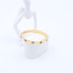 سوار رفيع لون ذهبي بتصميم عيون أزرق