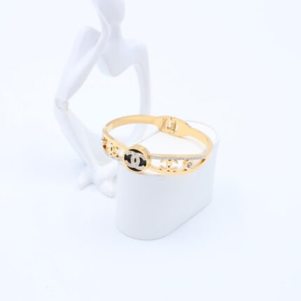 سوار لون ذهبي مع تفاصيل أسود وزركون فضي