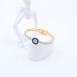 سوار لون ذهبي كع زركون فضي بتصميم عين