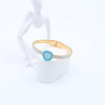 سوار لون ذهبي بتصميم عين لزن أزرق وزركون فضي