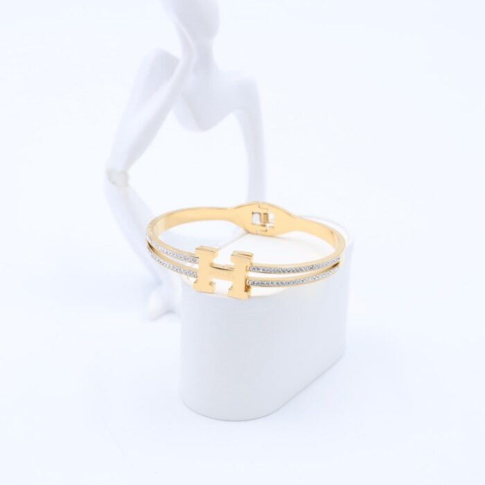 ⁦سوار لون ذهبي مع زركون فضي⁩ - الصورة ⁦2⁩