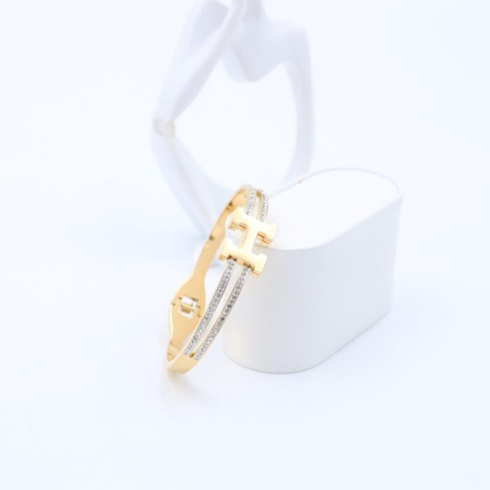 ⁦سوار لون ذهبي مع زركون فضي⁩ - الصورة ⁦3⁩