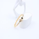 سوار لون ذهبي بتصميم ورو زركون أبيض وأسود