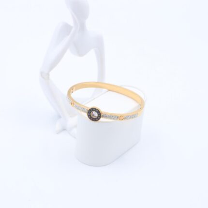 سوار لون ذهبي مع اركون فضي بتصميم دائره أسود