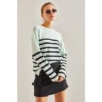 بلوزة شتوية باللون الفستقي مع الاسود