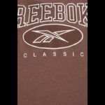 ⁦Reebok Women's Classics Archive Essentials Big Logo Crop- Brown⁩ - الصورة ⁦8⁩