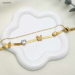 سوار تولاين أفعى مع فراشات متتالية لون ذهبي