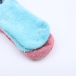 ⁦زوج جرابين بيتي شتوي ازرق فاتح+زهري DISNEY- STITCH نمرة 30-34⁩ - الصورة ⁦3⁩