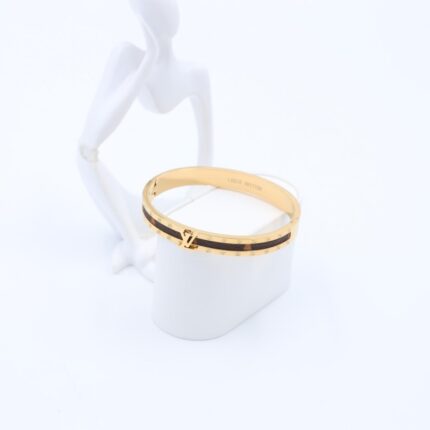 سوار لون ذهبي مع جلد بني