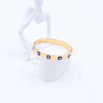 سوارعريض لون ذهبي مع عيون أزرق