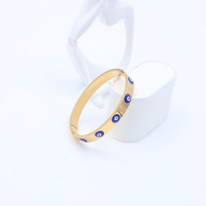 ⁦سوارعريض لون ذهبي مع عيون أزرق⁩ - الصورة ⁦2⁩